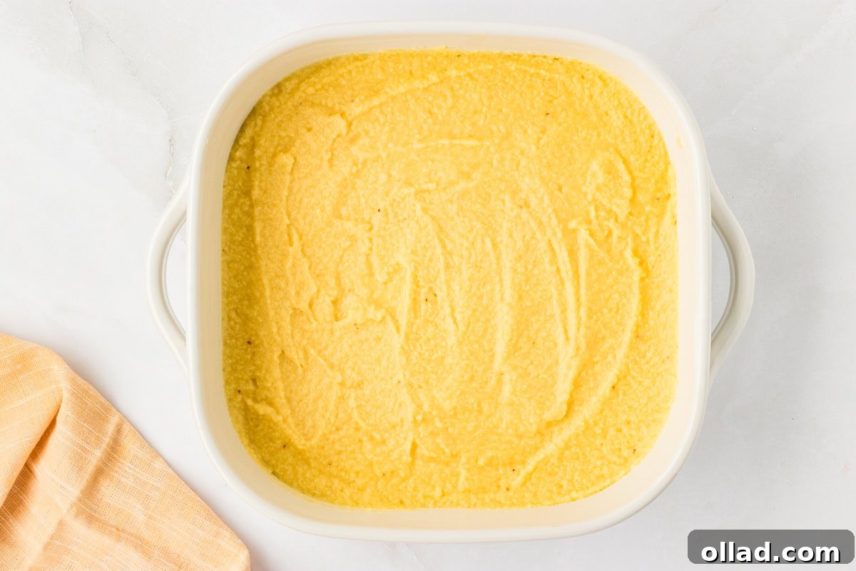 Ultimate Keto Cornbread 8 Cornbread batter spread evenly in a white baking dish before going into the oven.