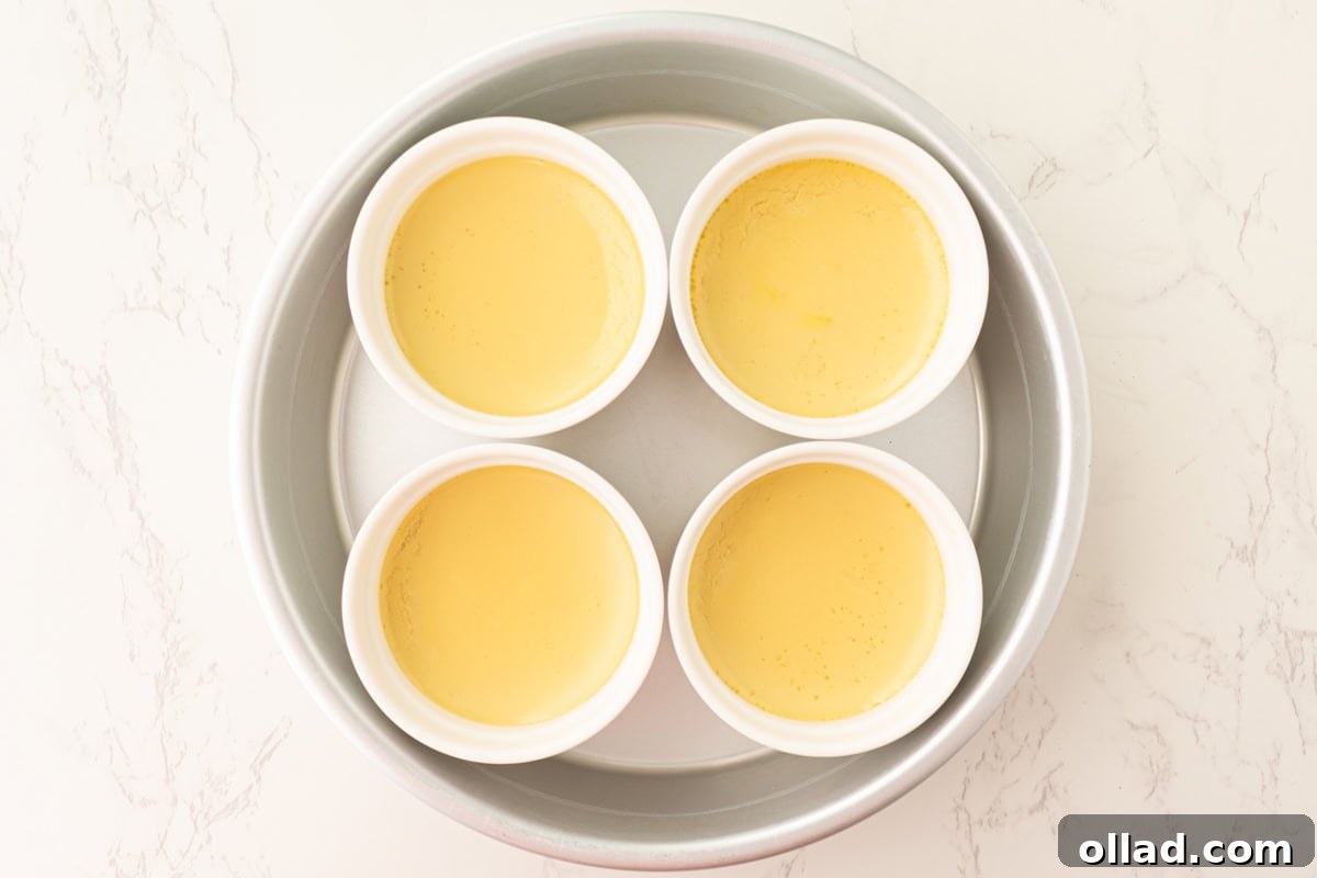 Dairy-free crème brûlée custards after baking, just set and pale yellow.