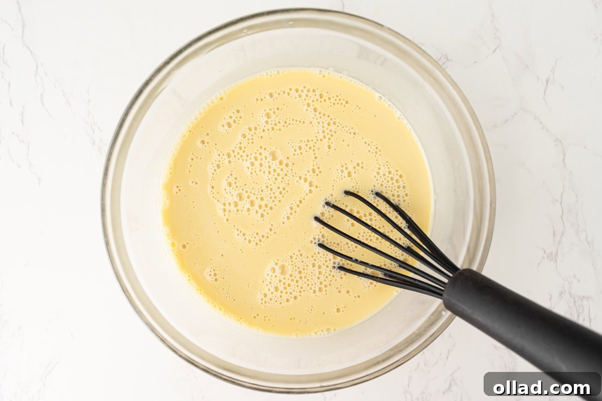 Smooth custard mixture after whisking coconut milk into egg yolks.
