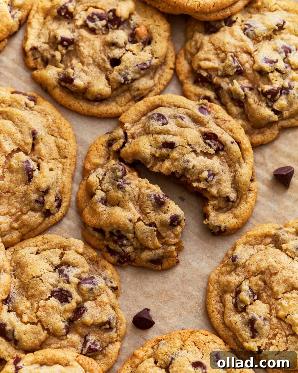 A stack of perfectly baked gluten-free chocolate chip cookies with melted chocolate chips