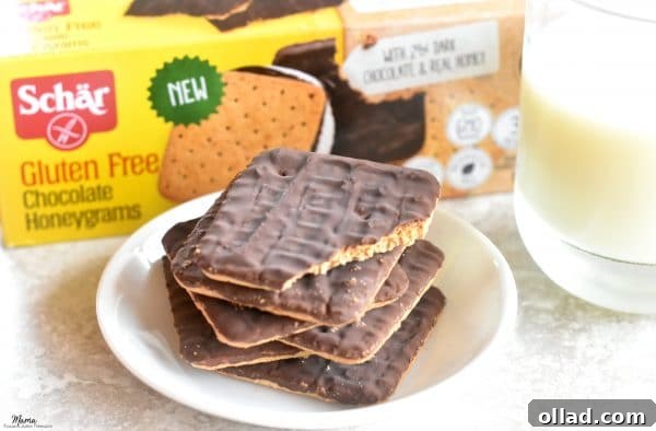 Guilt Free Chocolate Lasagna Bliss 5 Plate of Schär Chocolate Honeygrams cookies with the box and a glass of milk in the background