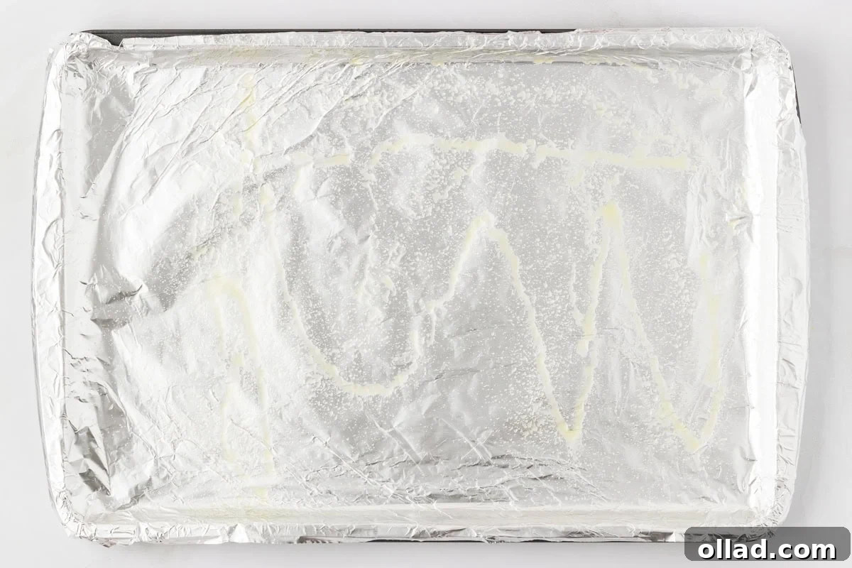 Delicious Gluten-Free Meatballs 5 Foil-lined baking sheet lightly sprayed with oil, ready for baking meatballs.