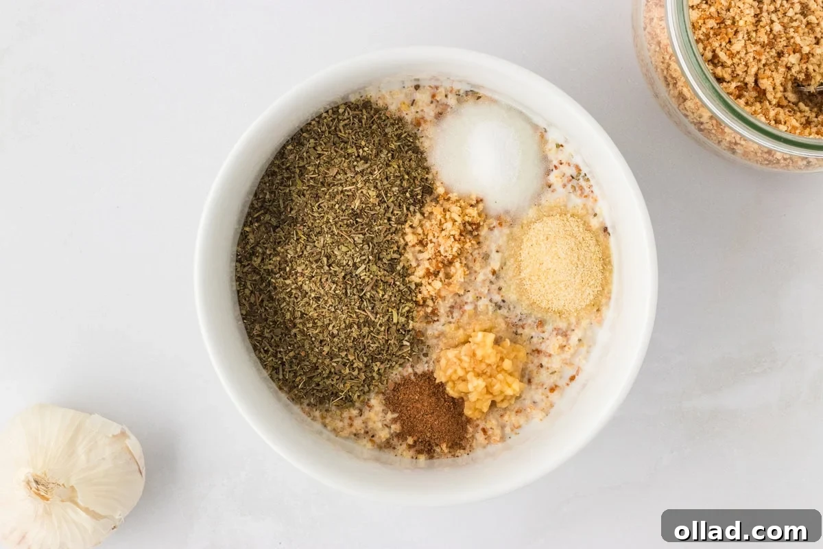 Delicious Gluten-Free Meatballs 6 White bowl filled with gluten-free breadcrumbs, dried Italian herbs, garlic, onion powder, and other seasonings for the meatball mixture.