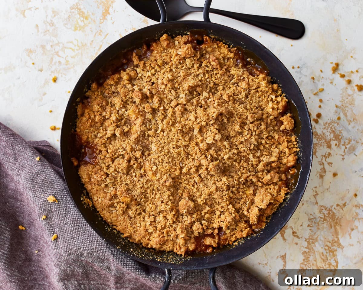 Wholesome Gluten-Free Apple Crumble 10 The baked gluten-free apple crisp in a glass baking dish, fresh out of the oven, with a perfectly golden and crisp topping and bubbling apple filling.