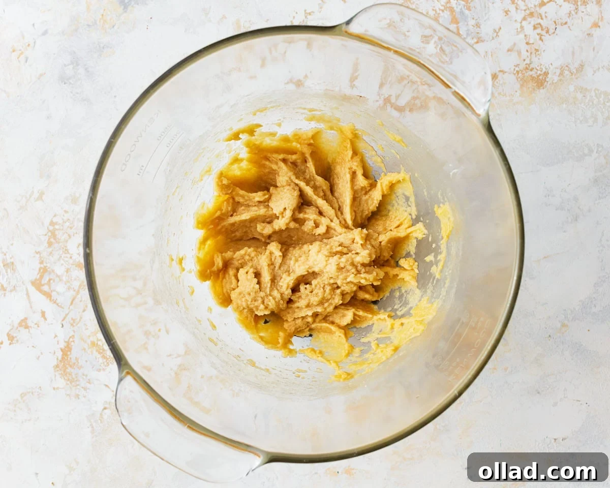 Wholesome Gluten-Free Oatmeal Cookies 8 wet ingredients for gluten-free oatmeal cookies in a glass bowl.