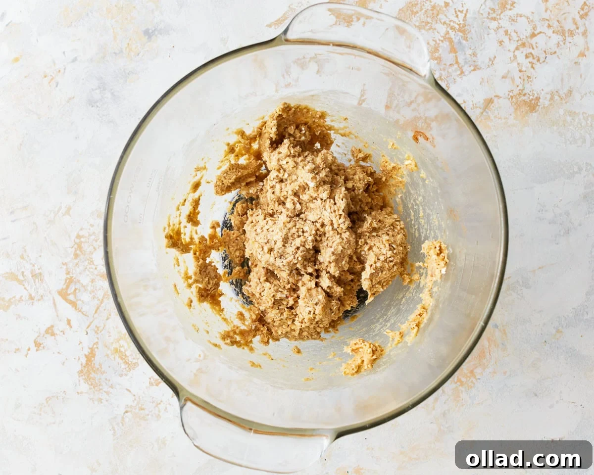 Wholesome Gluten-Free Oatmeal Cookies 9 gluten-free cookie dough in a glass bowl.