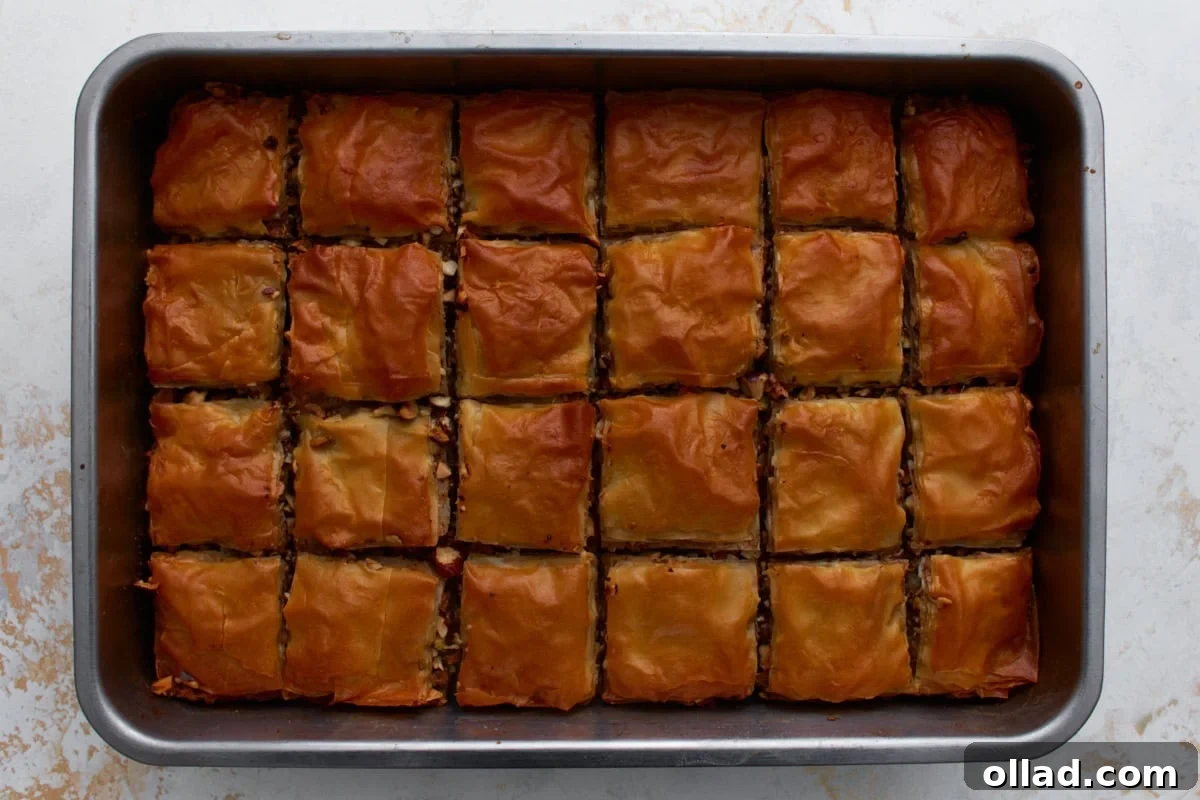 Golden brown gluten-free baklava baked in a rectangular pan.