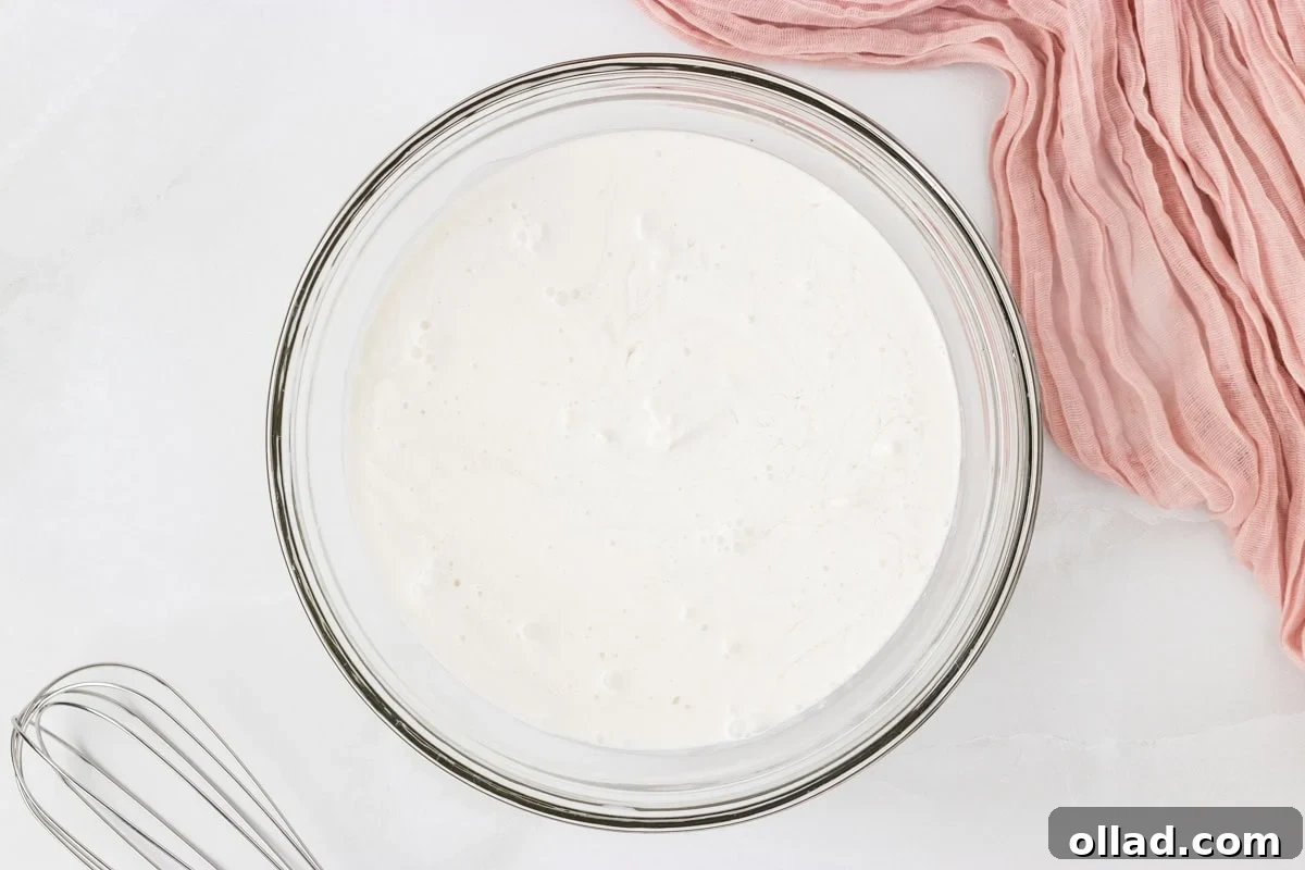 Coconut sorbet base mixed in a glass bowl before freezing.
