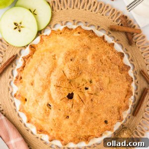A golden-brown gluten-free apple pie with a flaky crust