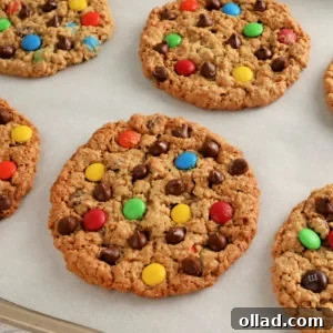 gluten-free monster cookies on white parchment paper.