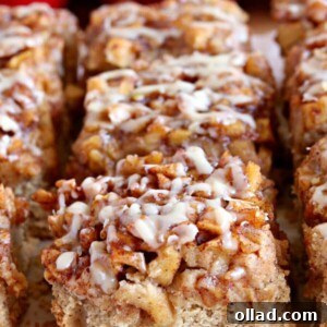 gluten-free apple pie blondies with red apples in the background